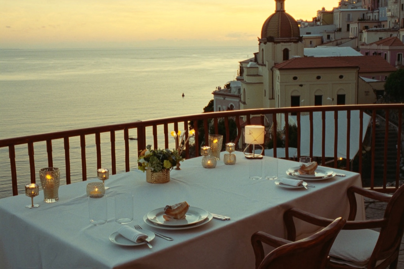 A private terrace dinner overlooking the Amalfi Coast at sunset
